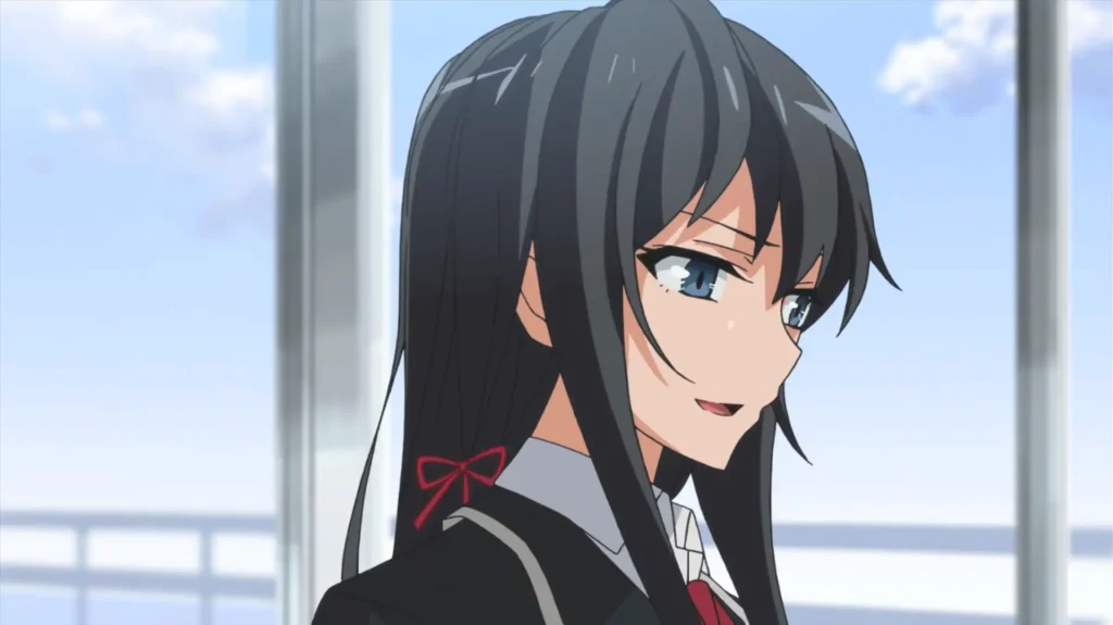 Close-up side profile of a long dark-haired schoolgirl with blue eyes and a faint, knowing smile. She wears a black blazer, white shirt, red tie, and a small red ribbon tied at the back of her hair. Soft blue sky and rooftop railings blur in the background.